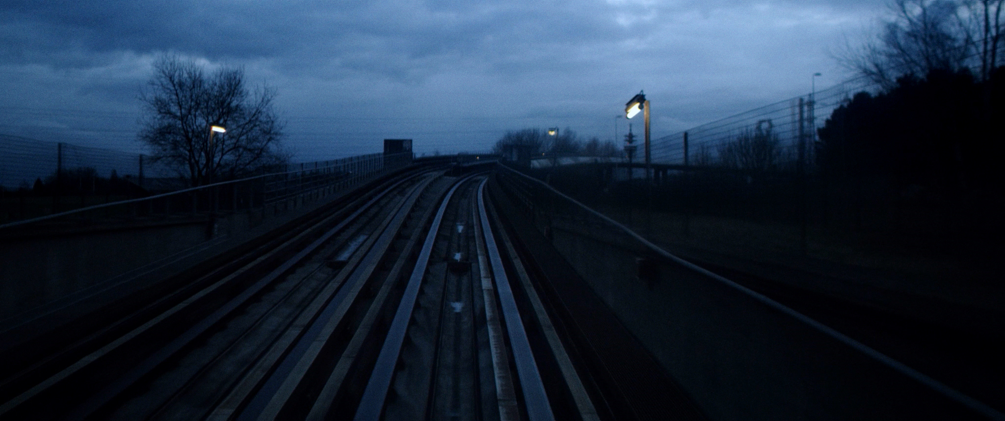 Maalbeek — train tracks at night, the shape of absence